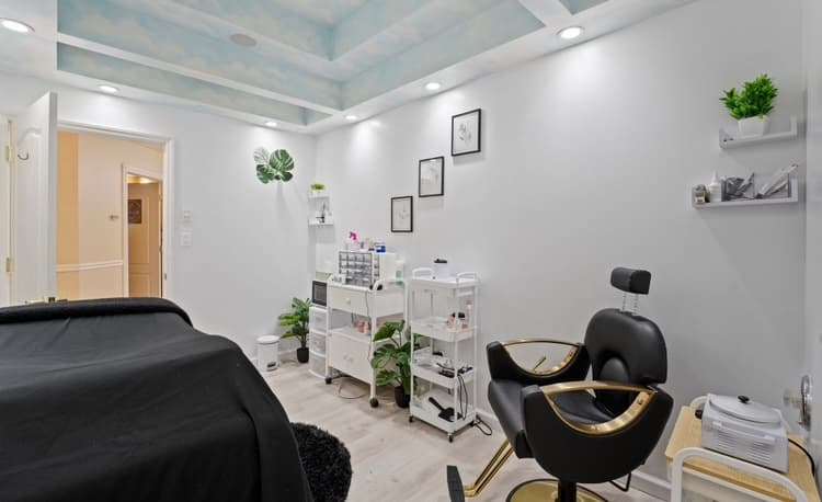 ReVibe treatment room with sky murals painted into the ceiling coffers